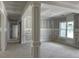 View of a light-filled room under construction with painted columns and walls at 196 Cozy Brook Ct, Clayton, NC 27520