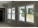 Two large, bright windows with view of the back yard at 196 Cozy Brook Ct, Clayton, NC 27520