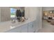 Bright bathroom boasts a dual sink vanity with white countertops and a decorative mirror at 196 Ethel Ln, Angier, NC 27501