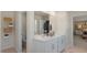 Bright bathroom with double vanity, white cabinetry, and modern fixtures at 196 Ethel Ln, Angier, NC 27501