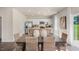 Bright kitchen with stainless steel appliances, granite countertops, an island, and an open view of the dining area at 196 Ethel Ln, Angier, NC 27501