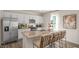 Stylish kitchen with white cabinetry, stainless steel appliances, and a central island with bar seating at 196 Ethel Ln, Angier, NC 27501