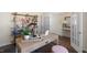 Bright and airy home office space, featuring a stylish desk, shelving and comfortable seating at 196 Ethel Ln, Angier, NC 27501