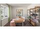 Cozy home office with natural light, open shelving, and a comfortable workspace for productivity at 196 Ethel Ln, Angier, NC 27501