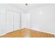 A bedroom featuring wood-look floors, and a double closet at 196 Tara Ln, Timberlake, NC 27583