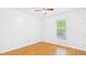 A sunlit bedroom featuring neutral paint, wood-look floors, and a window at 196 Tara Ln, Timberlake, NC 27583