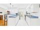 Well-lit kitchen area featuring white cabinets and stainless-steel appliances at 196 Tara Ln, Timberlake, NC 27583