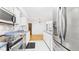 Modern kitchen with stainless steel appliances, white cabinets, and blue countertops at 196 Tara Ln, Timberlake, NC 27583