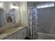 Bathroom featuring double sink vanity and bathtub with shower at 2018 Groundwater Pl, Raleigh, NC 27610