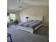 Bedroom with carpet, ceiling fan and home office setup at 2018 Groundwater Pl, Raleigh, NC 27610