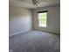 Carpeted bedroom with natural light at 2018 Groundwater Pl, Raleigh, NC 27610