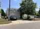 Traditional two-story home featuring a two-car garage and a well-manicured lawn with mature trees at 2018 Groundwater Pl, Raleigh, NC 27610