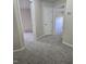 Hallway featuring carpet and access to bedrooms at 2018 Groundwater Pl, Raleigh, NC 27610