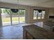Kitchen and dining area with sliding door access to the backyard at 2018 Groundwater Pl, Raleigh, NC 27610