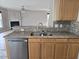 Kitchen featuring granite countertops, stainless steel appliances and view to living room at 2018 Groundwater Pl, Raleigh, NC 27610