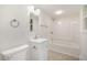 Well-lit bathroom with a shower-tub combo, modern vanity, and sleek fixtures at 2027 Jefferson Dr, Hillsborough, NC 27278