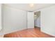 Sunlit bedroom with hardwood flooring and white trim at 2027 Jefferson Dr, Hillsborough, NC 27278