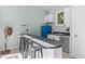 This wet bar features a refrigerator, sink, and seating for three at 204 Rossburn Way, Chapel Hill, NC 27516