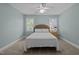 Spacious bedroom featuring two windows and a ceiling fan at 204 Rossburn Way, Chapel Hill, NC 27516