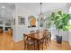 Dining room with a wooden table and large windows at 204 Rossburn Way, Chapel Hill, NC 27516