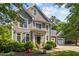 Charming two-story home with an inviting entrance and beautifully landscaped front yard, perfect for curb appeal at 204 Rossburn Way, Chapel Hill, NC 27516