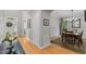 Bright hallway that connects to the office, dining room, and foyer with hardwood floors and neutral paint at 204 Rossburn Way, Chapel Hill, NC 27516