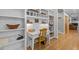 Bright home office nook with custom built-ins and classic desk at 204 Rossburn Way, Chapel Hill, NC 27516