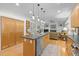 Spacious kitchen featuring stainless steel appliances, wood cabinets, and an island at 204 Rossburn Way, Chapel Hill, NC 27516