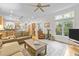 Open living room with hardwood floors and a view into the kitchen at 204 Rossburn Way, Chapel Hill, NC 27516