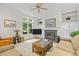 Cozy living room featuring a fireplace and built-in shelving at 204 Rossburn Way, Chapel Hill, NC 27516