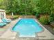 Relax and unwind by the sparkling pool in this private and beautifully landscaped backyard at 204 Rossburn Way, Chapel Hill, NC 27516