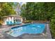 Enjoy outdoor living at its finest with this beautiful pool and outdoor lounge area at 204 Rossburn Way, Chapel Hill, NC 27516