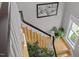 Staircase with decorative railing leading upstairs; natural light fills the space at 204 Rossburn Way, Chapel Hill, NC 27516