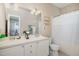Bright bathroom featuring a double sink vanity, ample countertop space, and decorative lighting at 209 Mccarthy Dr, Clayton, NC 27527