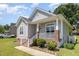 Charming home with a covered front porch and well-maintained landscaping at 209 Mccarthy Dr, Clayton, NC 27527