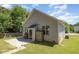A view of the back of the house showing the siding, patio area, and storage shed at 209 Mccarthy Dr, Clayton, NC 27527