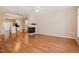 Open concept living space featuring hardwood floors, a fireplace, and seamless access to the kitchen at 209 Mccarthy Dr, Clayton, NC 27527