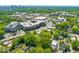 Expansive aerial view showcasing the property's location in a vibrant community with tree-lined streets at 2210 Bedford Ave, Raleigh, NC 27607