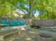 Picturesque backyard with a water feature, fire pit, and seating for outdoor enjoyment at 2210 Bedford Ave, Raleigh, NC 27607