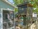 Relaxing backyard featuring a treehouse and a patio with a cozy fire pit, perfect for outdoor gatherings at 2210 Bedford Ave, Raleigh, NC 27607