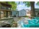 Inviting backyard featuring a custom treehouse, outdoor seating, and a serene ambiance at 2210 Bedford Ave, Raleigh, NC 27607