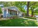 Charming exterior view of a well-maintained home with a lush lawn, offering curb appeal and inviting ambiance at 2210 Bedford Ave, Raleigh, NC 27607