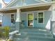 Charming front porch with rocking chairs, providing a welcoming entrance to this lovely home at 2210 Bedford Ave, Raleigh, NC 27607
