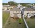 Aerial view of the back exterior of home with a wood deck and fenced yard at 232 Kanewind Ter, Apex, NC 27523