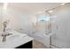 Clean and modern bathroom with soaking tub, shower, and quartz countertops at 232 Kanewind Ter, Apex, NC 27523