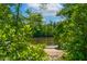 Community boat ramp leading to a peaceful lake surrounded by lush greenery and trees at 232 Kanewind Ter, Apex, NC 27523
