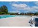 Spacious community pool area with a zero entry pool, tanning ledges and lounge chairs at 232 Kanewind Ter, Apex, NC 27523