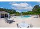 Large community pool area with tables, chairs, and a splash pad in a pleasant location at 232 Kanewind Ter, Apex, NC 27523