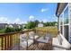 Exterior deck features patio furniture and a view of the pond and neighborhood at 232 Kanewind Ter, Apex, NC 27523