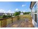 Expansive wooden deck overlooking a pond and the peaceful surrounding landscape at 232 Kanewind Ter, Apex, NC 27523